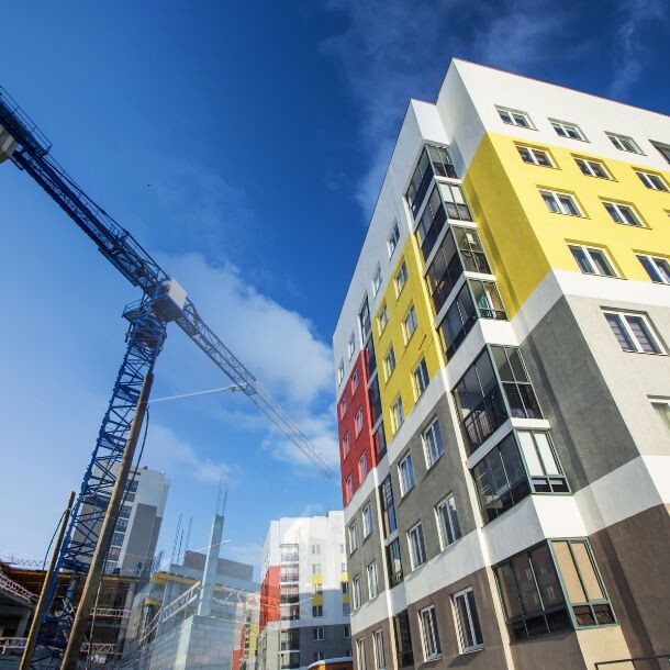 Upward shot of a newly constructed building and a crane