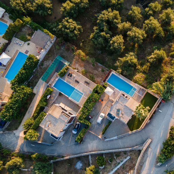 Top shot of a city with houses, roads, and trees