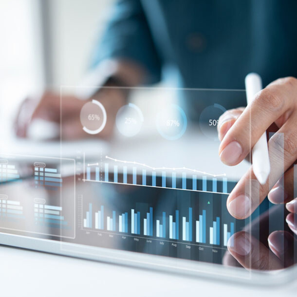Close-up of a tablet displaying business analytics charts and graphs