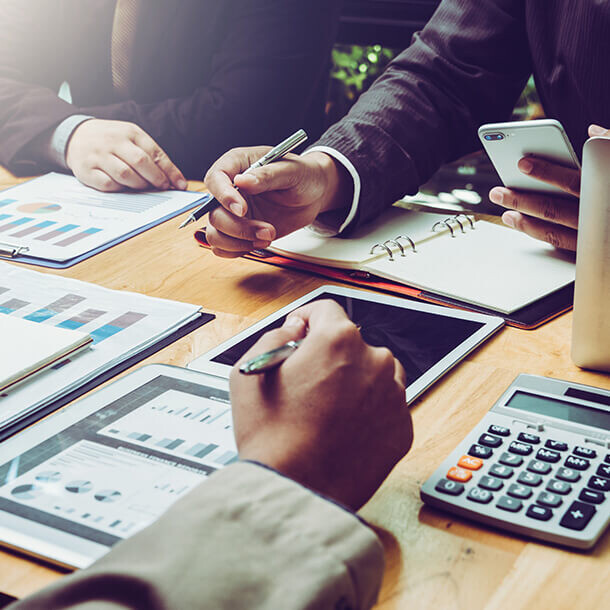 Tax lawyer and business executive meeting to discuss SME taxation.