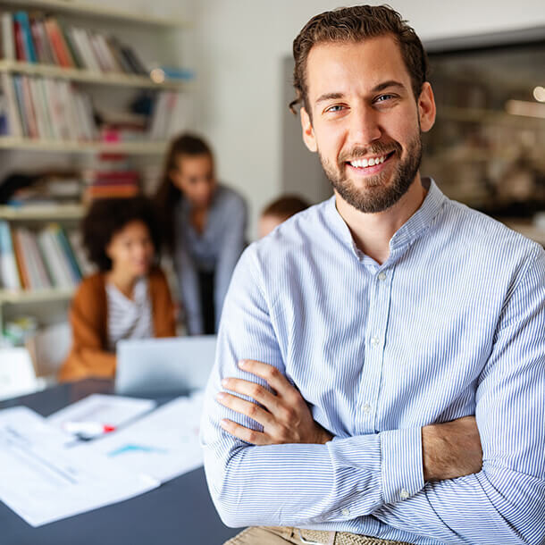 Happy workers in a successful company business meeting.