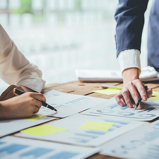 Business executives meeting to discuss SME tax collection challenges.