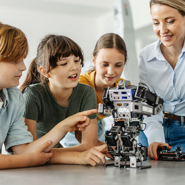 Children building robots in an after-school robotics club.
