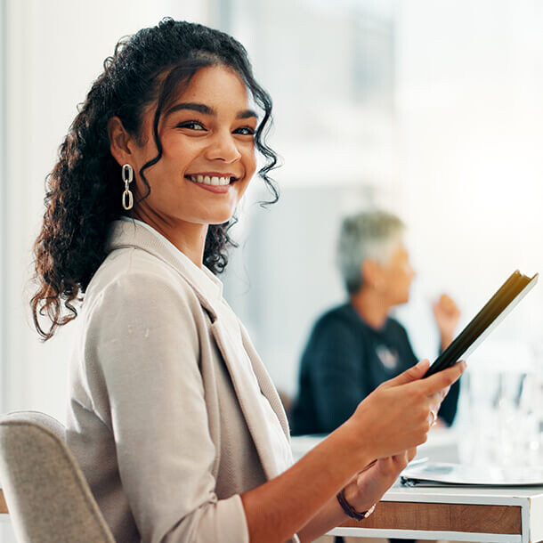 Businesswoman with tablet in office representing tax consulting and bookkeeping.