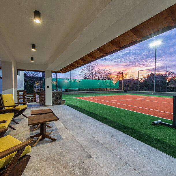 Tennis court at a private estate at twilight.